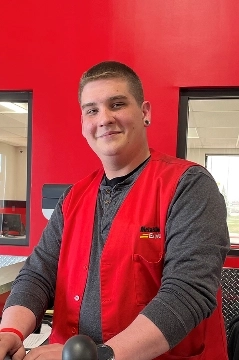 a man in a red jacket