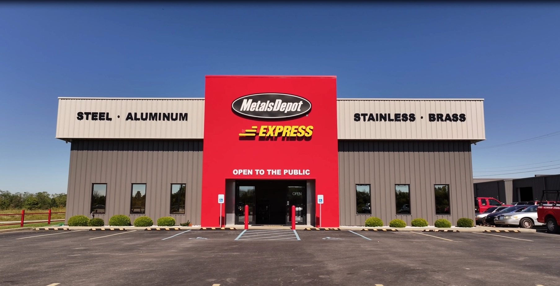 Bold red Metals Depot Express storefront with Open to the Public signage.