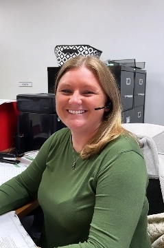 a woman smiling at the camera